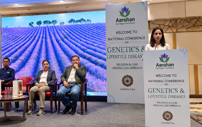 Panellists in discussion in front of the conference screen