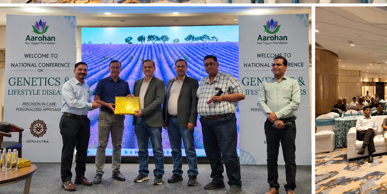 Participants being felicitated with a memento on stage between the conference welcome banners