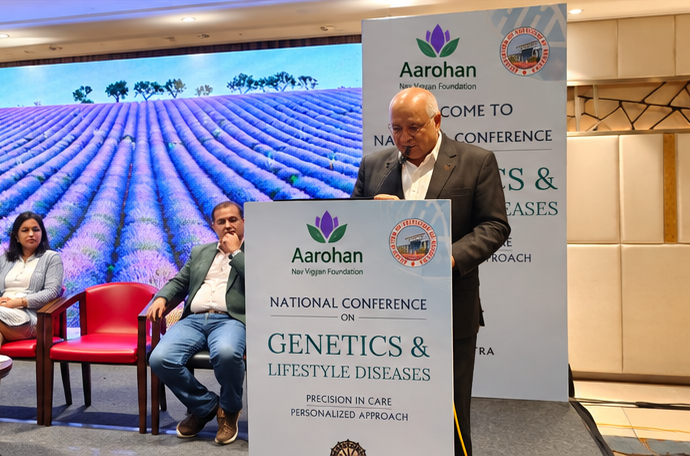 A session in progress in front of the conference welcome banner